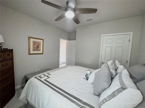 a bedroom with furniture and a window