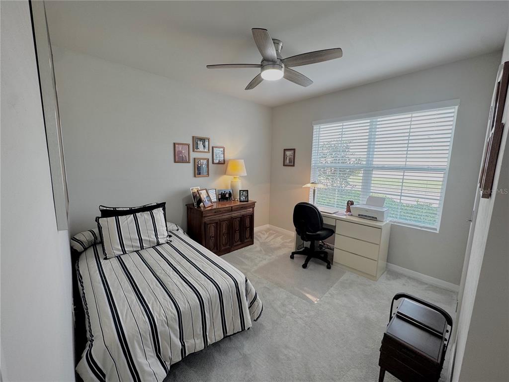 4077 Manatee Lane Punta Gorda, FL 33980 - Photo 25 of 35 a bedroom with furniture and a window