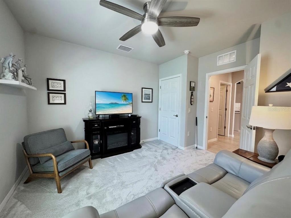 4077 Manatee Lane Punta Gorda, FL 33980 - Photo 31 of 35 a living room with furniture and a flat screen tv