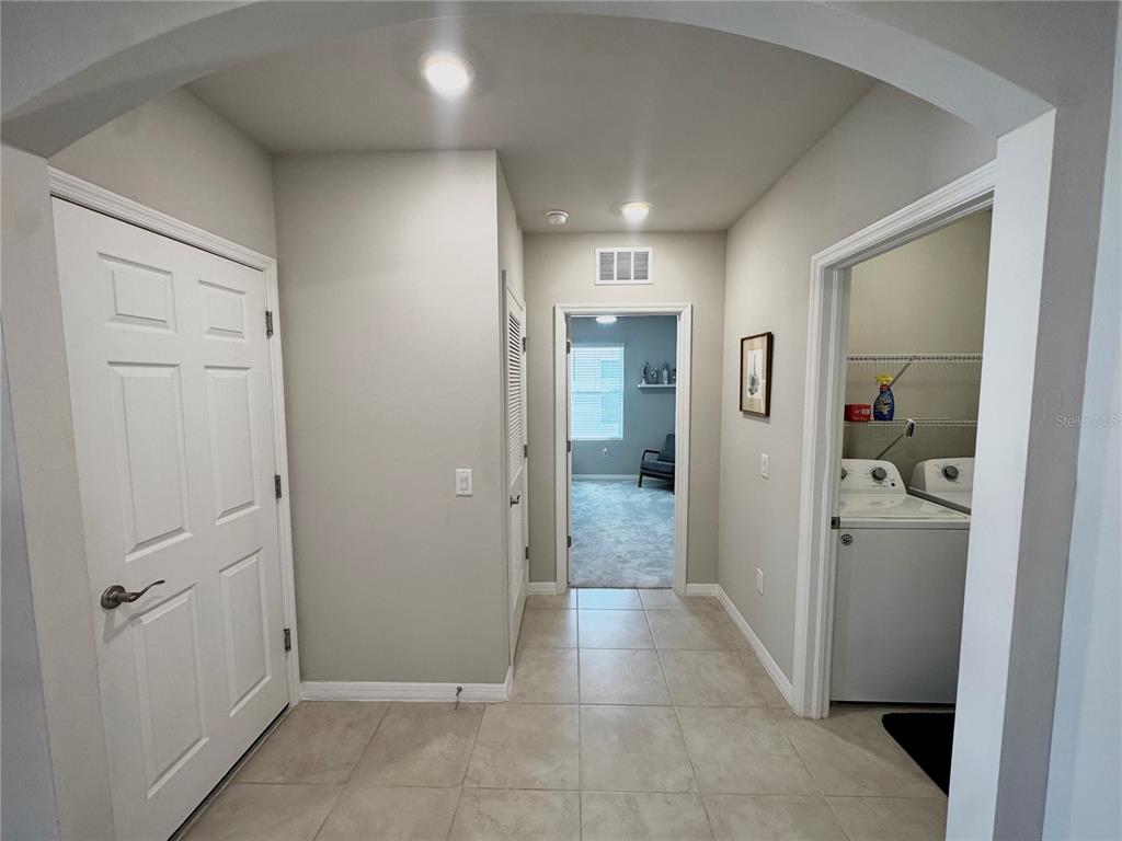 4077 Manatee Lane Punta Gorda, FL 33980 - Photo 32 of 35 a view of a hallway with closet and bathroom