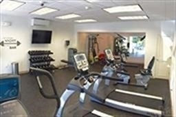1 Stonehill Drive, Unit 3C Stoneham, MA 02180 - Photo 5 of 5 a view of a livingroom with furniture and flat screen tv