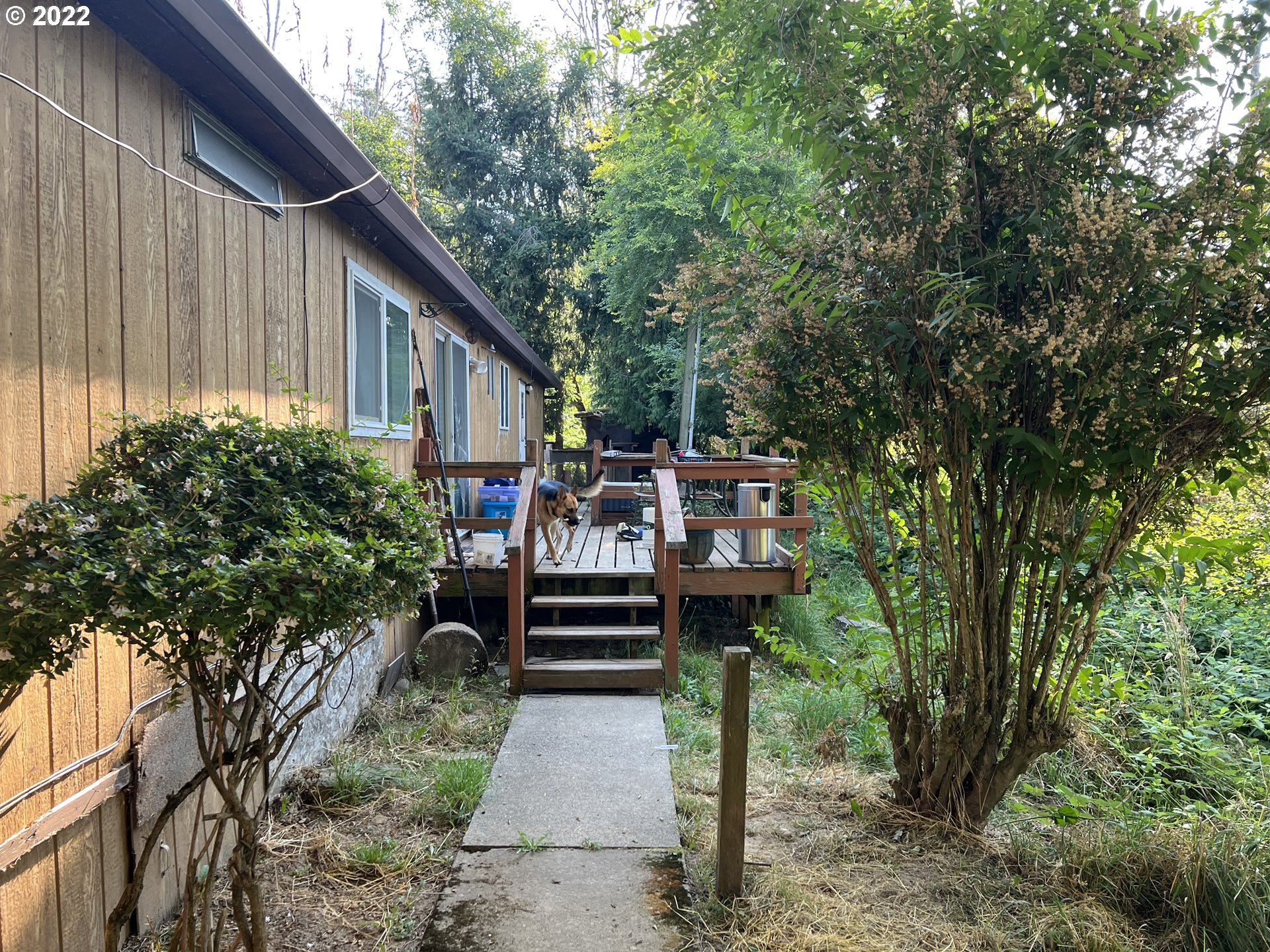 30425 East Woodard Road Troutdale, OR 97060 - Photo 2 of 8 a view of a chairs and tables in the backyard of a house
