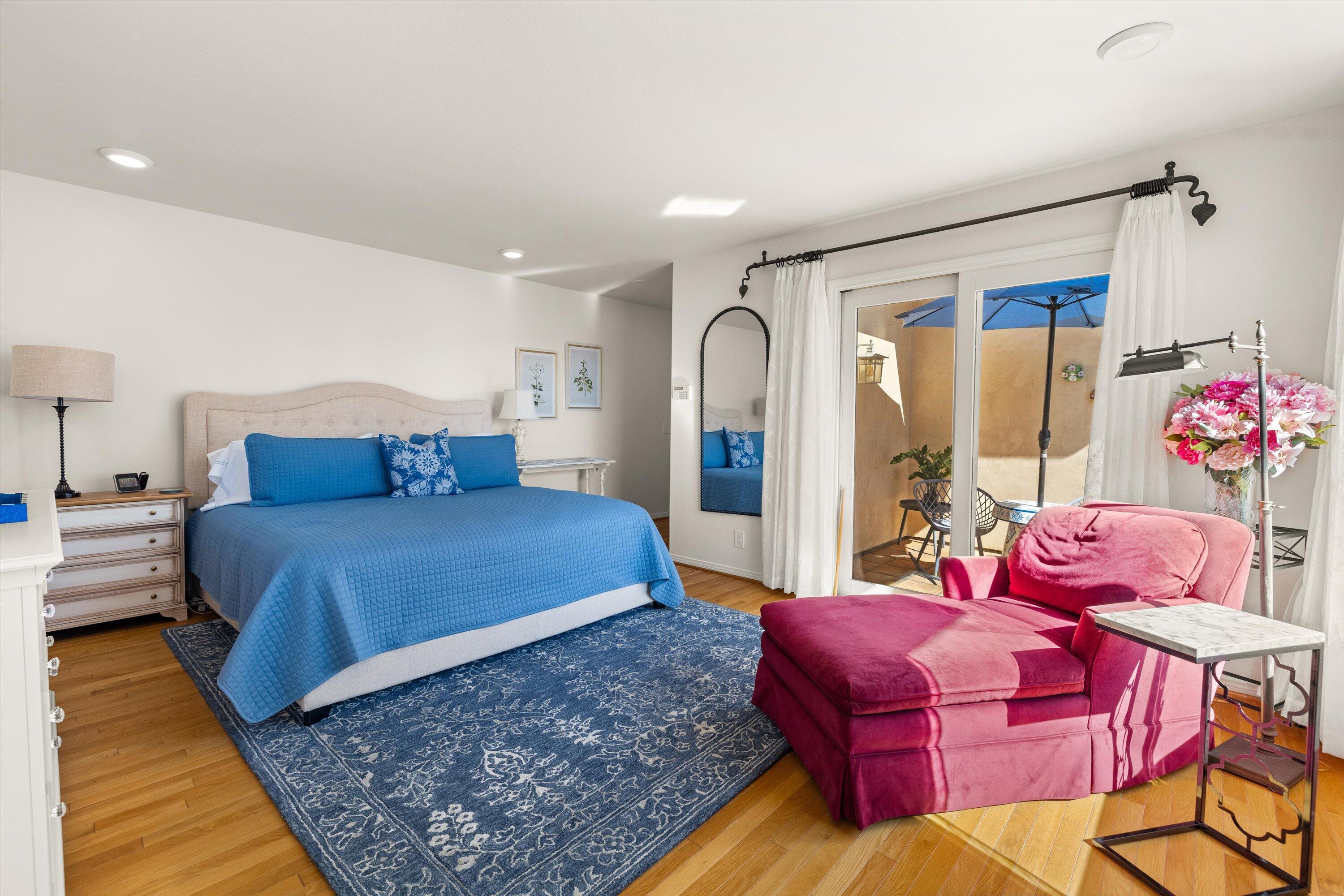 222 Meigs Road, Unit 16 Santa Barbara, CA 93109 - Photo 20 of 44 a bedroom with a bed and wooden floor