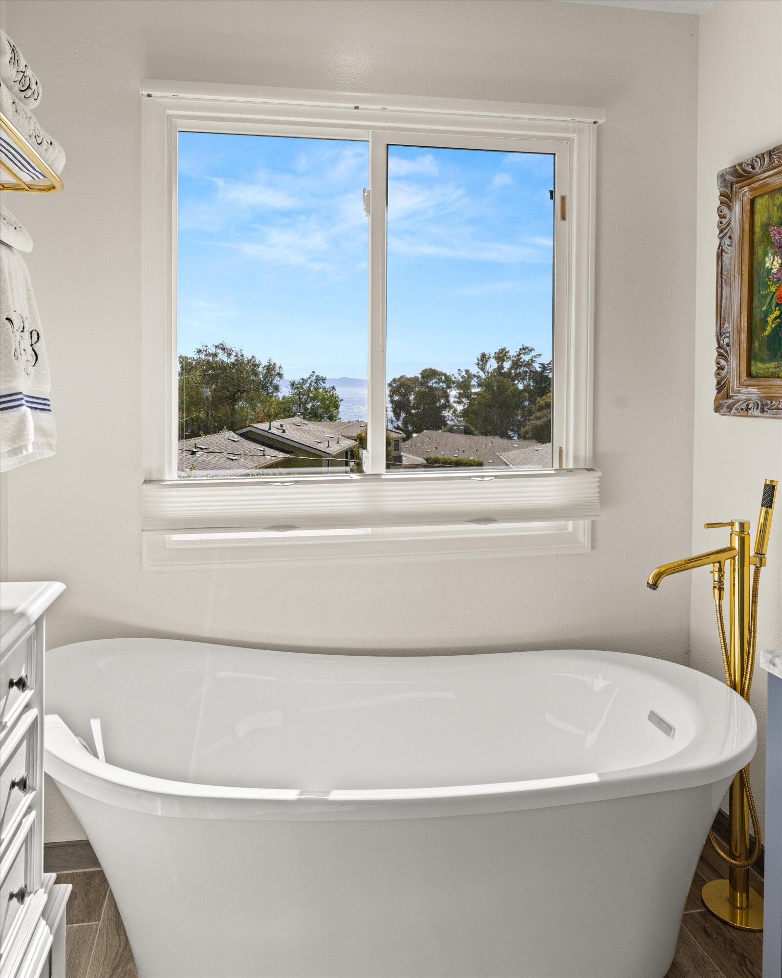 222 Meigs Road, Unit 16 Santa Barbara, CA 93109 - Photo 24 of 44 a white bath tub sitting next to a window