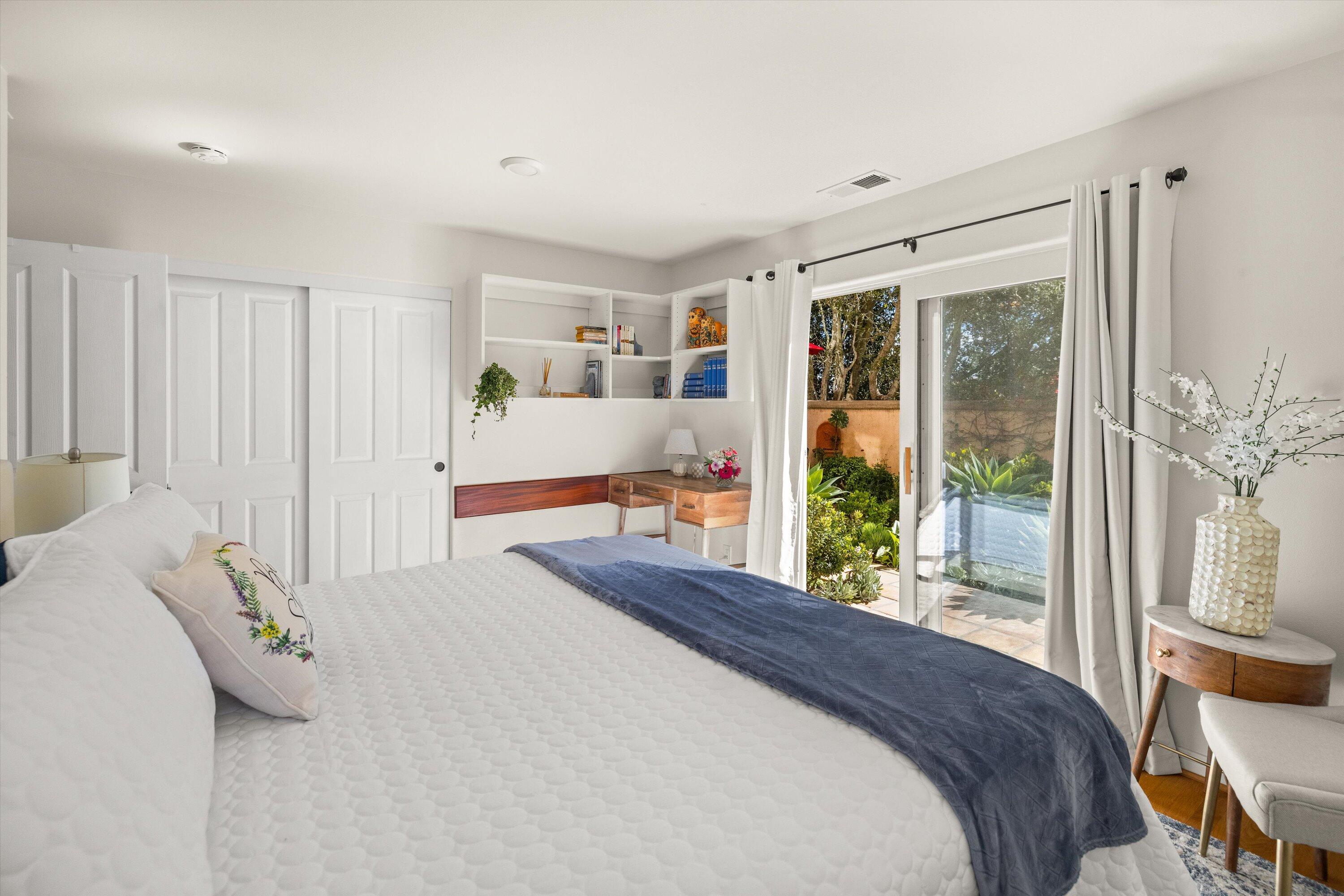 222 Meigs Road, Unit 16 Santa Barbara, CA 93109 - Photo 29 of 44 a bed sitting in a spacious bedroom next to a window