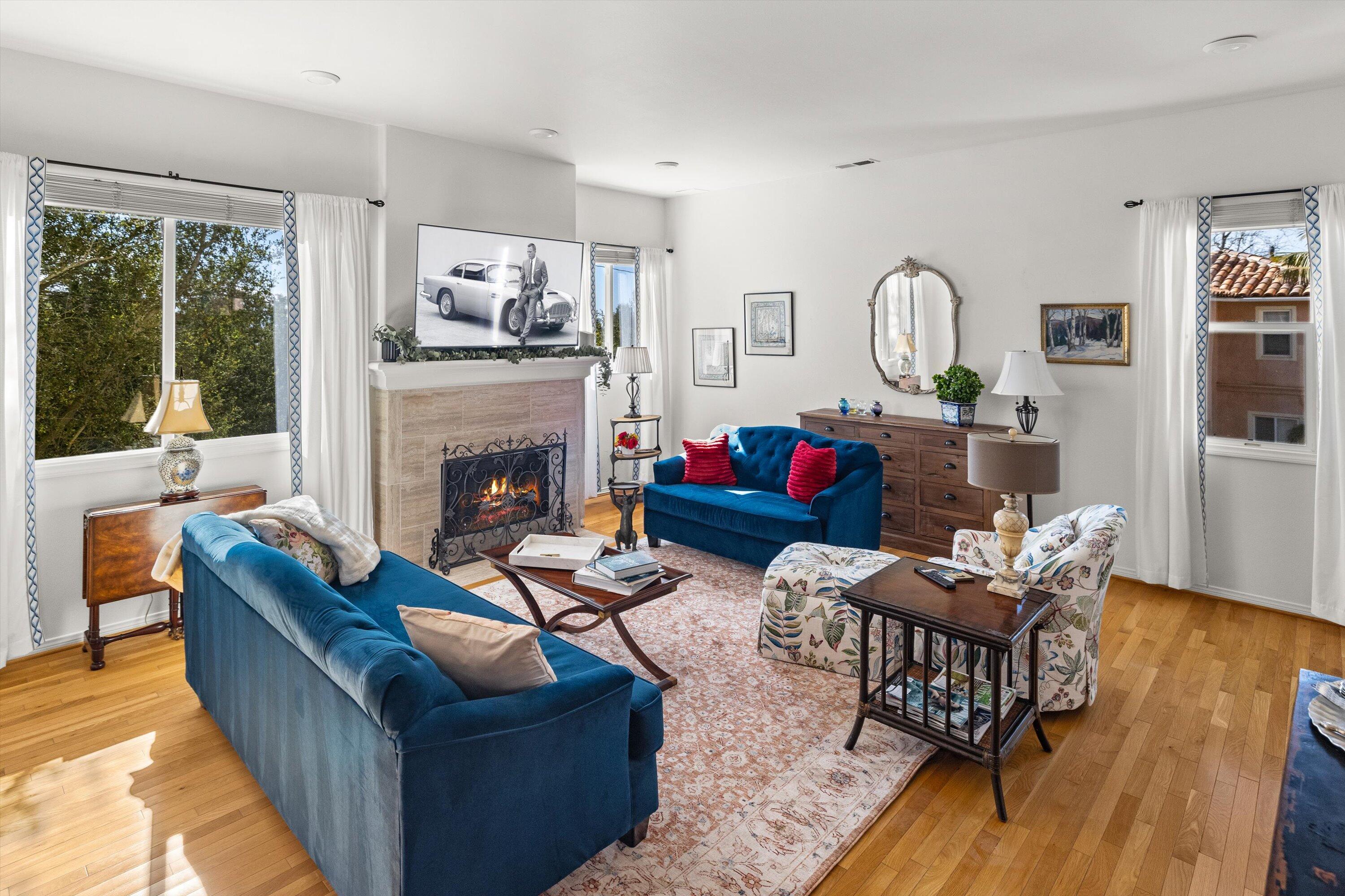 222 Meigs Road, Unit 16 Santa Barbara, CA 93109 - Photo 3 of 44 a living room with furniture and a fireplace