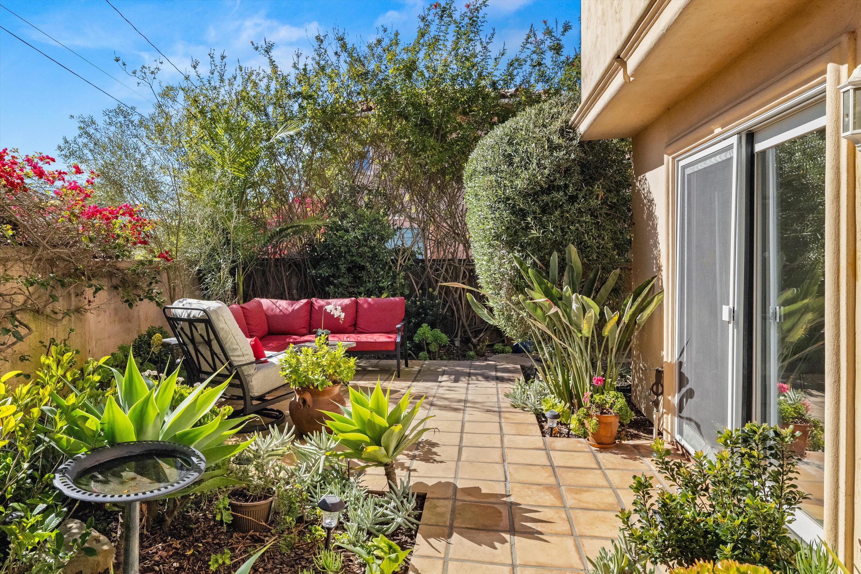 222 Meigs Road, Unit 16 Santa Barbara, CA 93109 - Photo 34 of 44 a wooden bench sitting in front of a building