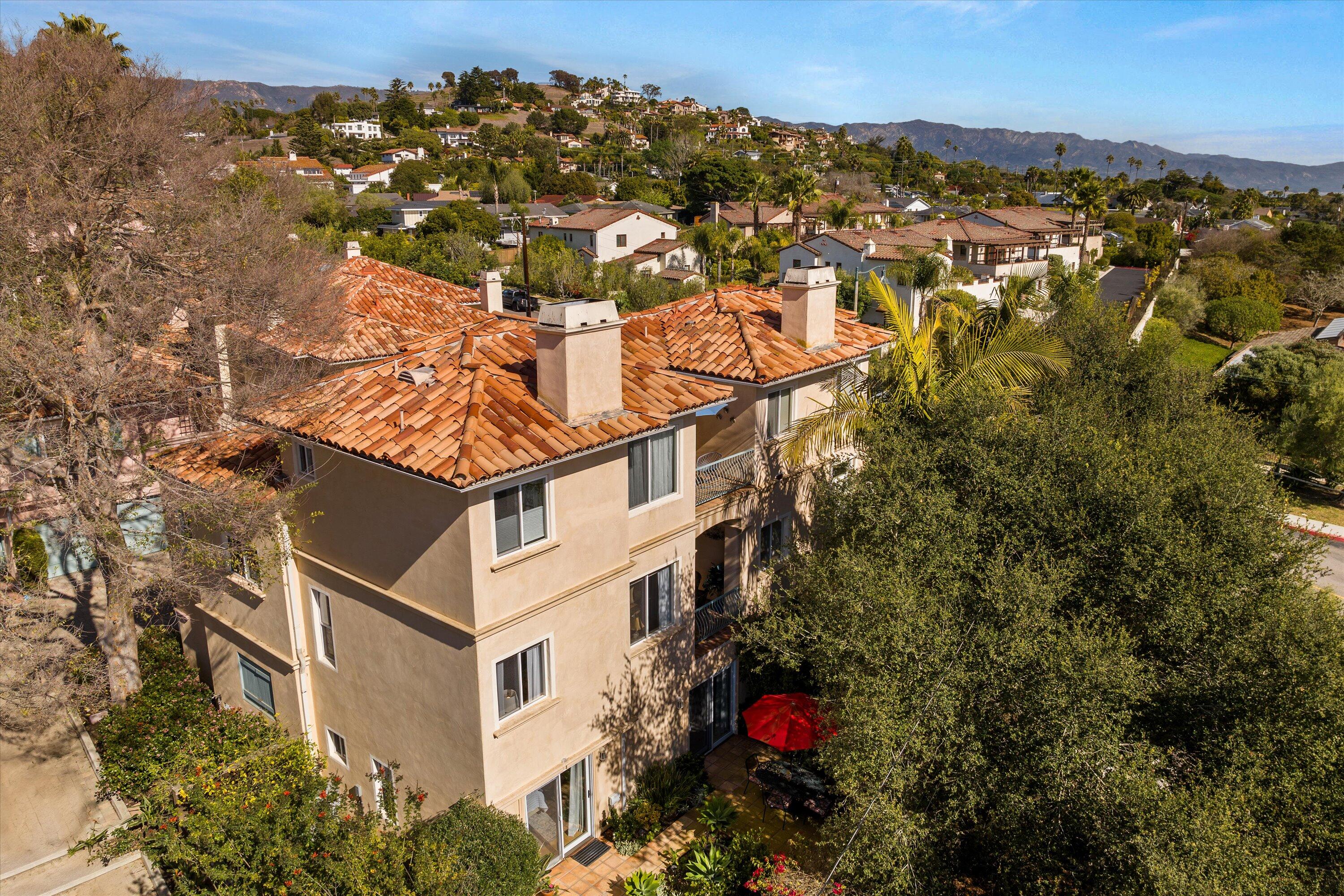 222 Meigs Road, Unit 16 Santa Barbara, CA 93109 - Photo 36 of 44 a view of a house with a yard and mountain view in back
