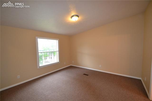 1308 Forest Road Colorado Springs, CO 80906 - Photo 17 of 34 Master Bedroom