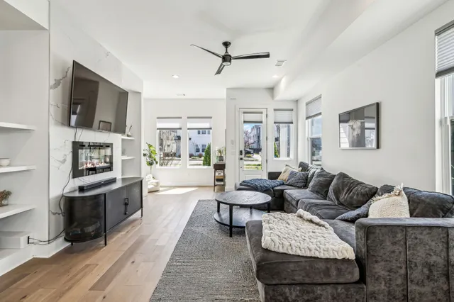 a living room with furniture fireplace and a flat screen tv