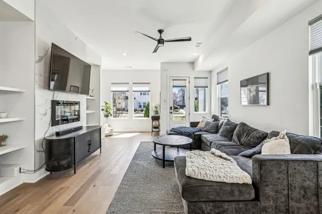 a living room with furniture fireplace and a flat screen tv