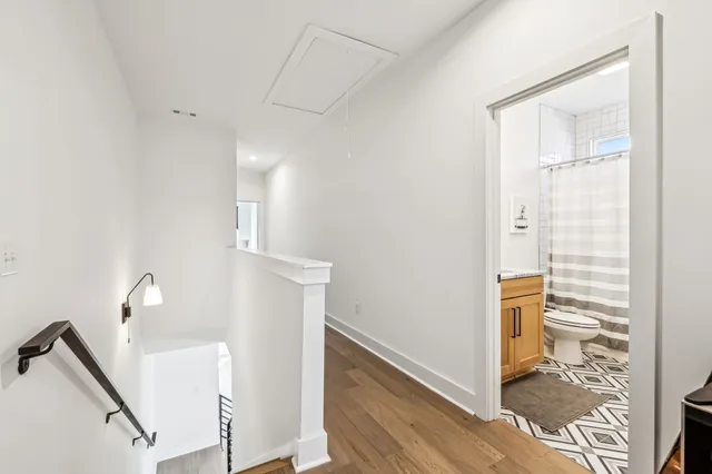 a view of an entryway with wooden floor