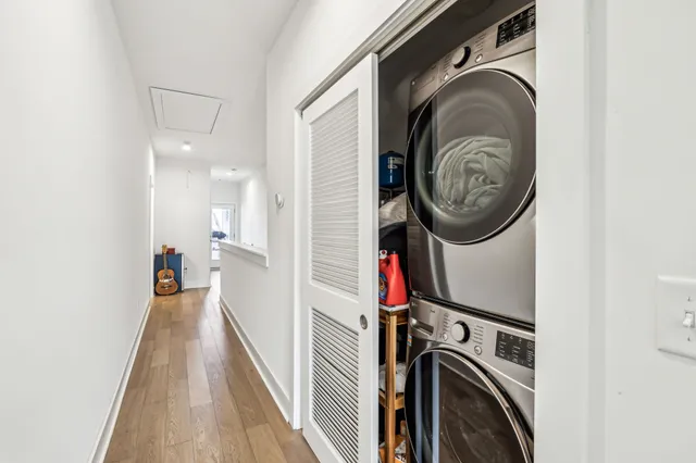 a view of a hallway with washer and dryer