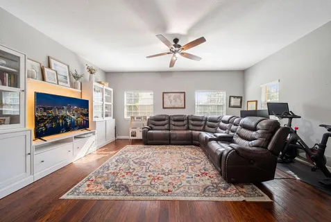 a view of living room with furniture and flat screen tv