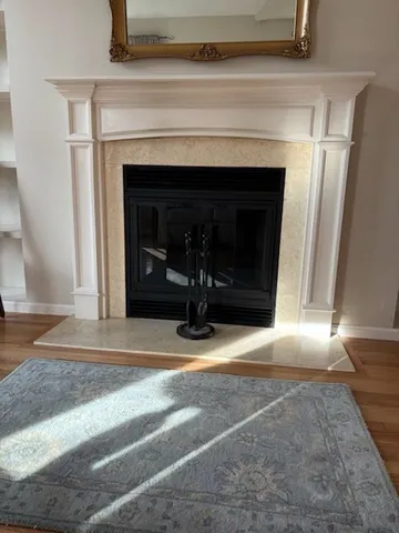 a view of fireplace and a chandelier