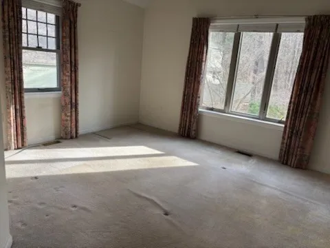 an empty room with windows