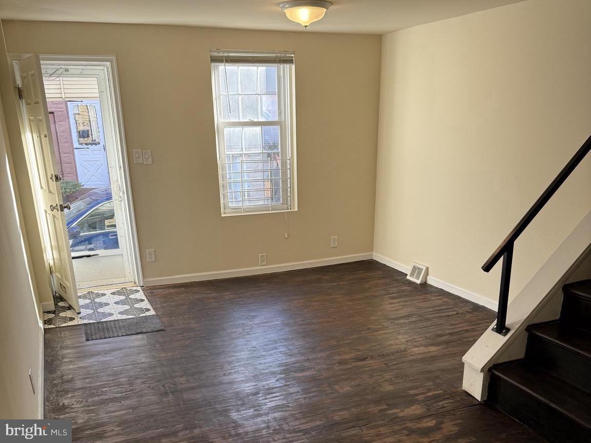 223 Gerritt Street Philadelphia, PA 19147 - Photo 2 of 10 a view of an empty room with wooden floor and a window