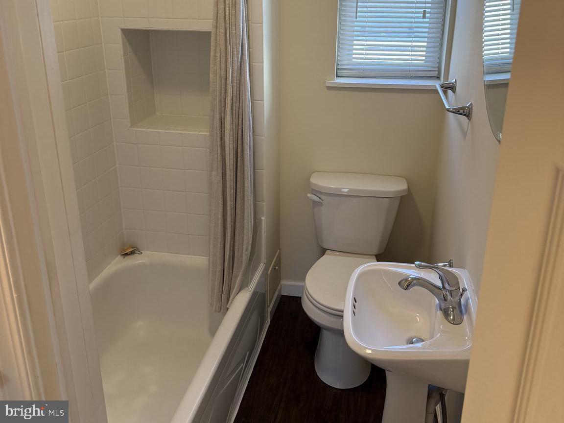 223 Gerritt Street Philadelphia, PA 19147 - Photo 9 of 10 a bathroom with a toilet sink and mirror