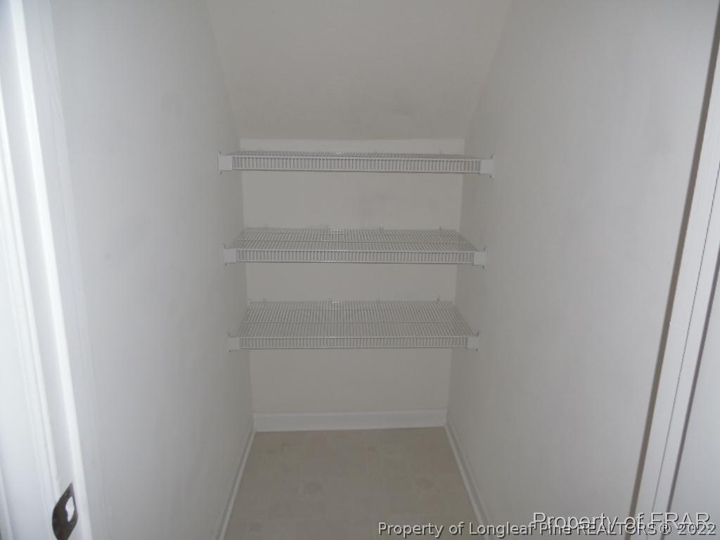 76 Ithica Lane Bunnlevel, NC 28323 - Photo 11 of 35 a view of walk in closet with empty racks