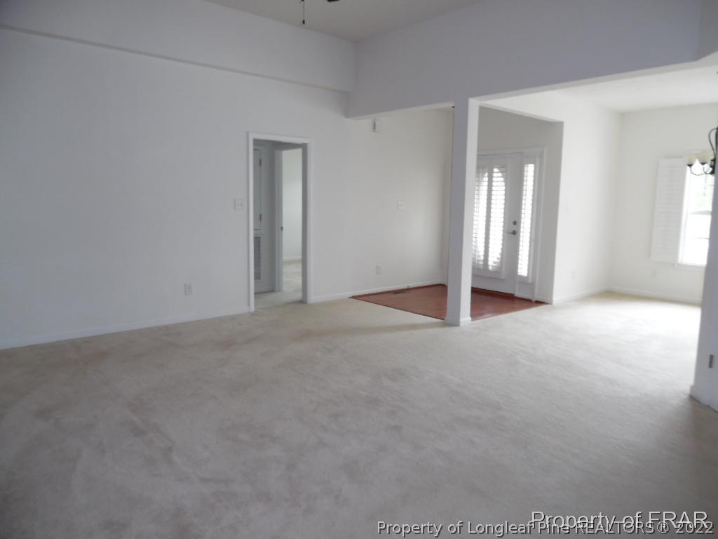 76 Ithica Lane Bunnlevel, NC 28323 - Photo 14 of 35 a view of a big room with windows and chandelier fan
