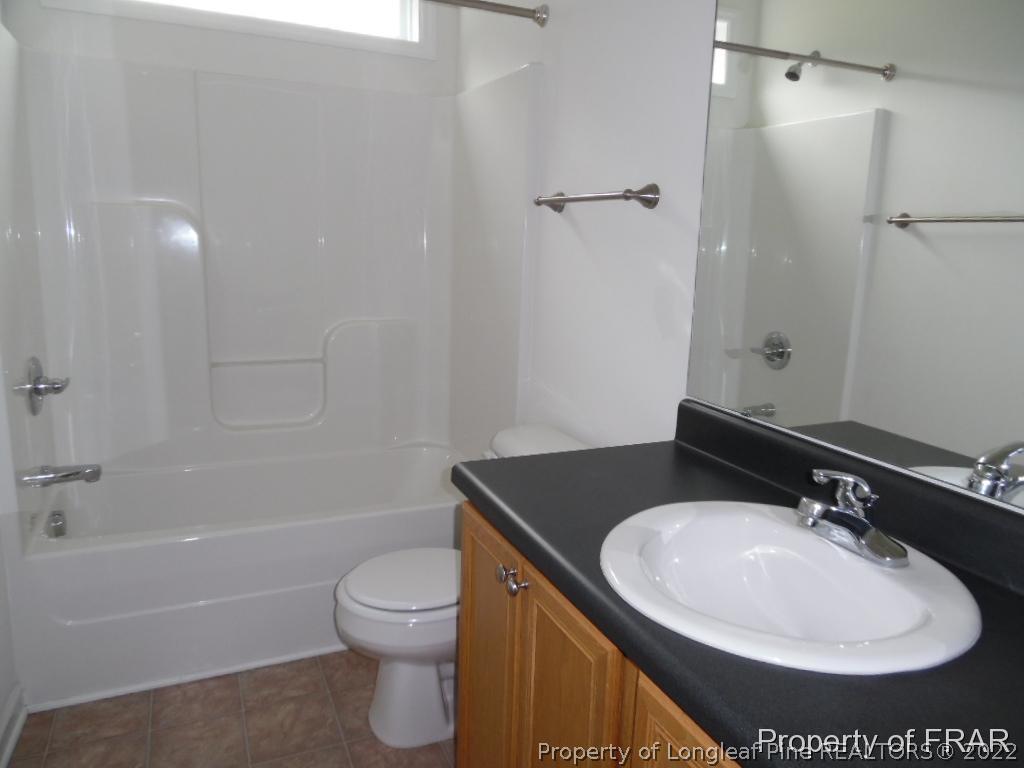 76 Ithica Lane Bunnlevel, NC 28323 - Photo 26 of 35 a bathroom with a sink toilet and shower