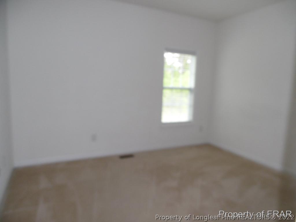 76 Ithica Lane Bunnlevel, NC 28323 - Photo 28 of 35 an empty room with a window
