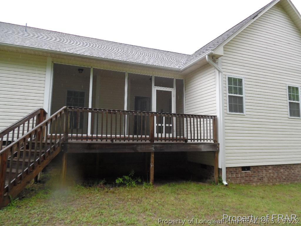 76 Ithica Lane Bunnlevel, NC 28323 - Photo 35 of 35 a view of a house with a wooden deck