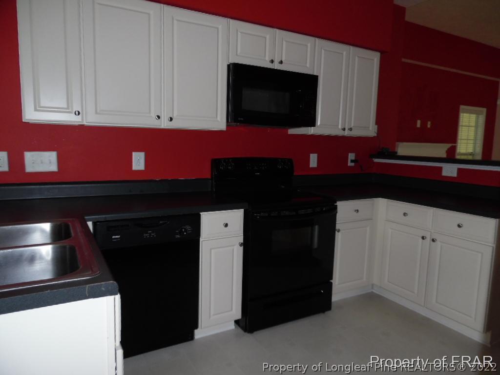 76 Ithica Lane Bunnlevel, NC 28323 - Photo 9 of 35 a kitchen with stainless steel appliances granite countertop a refrigerator and a microwave