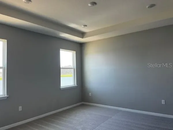 a large kitchen with stainless steel appliances a large counter top