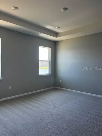 a kitchen with stainless steel appliances granite countertop a refrigerator a sink a stove top oven and a sink