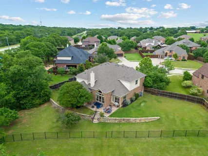 an aerial view of a house with a garden