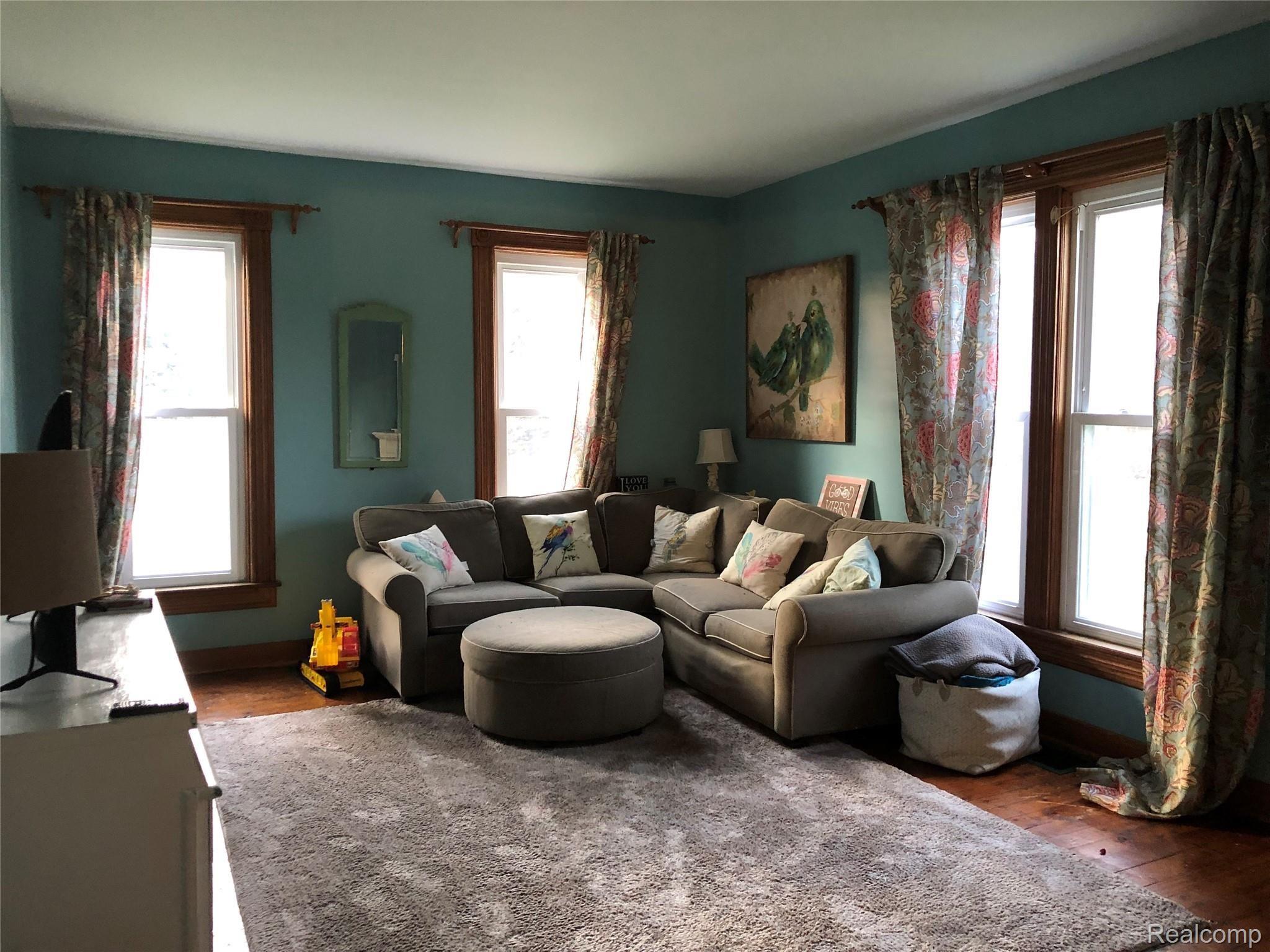 Living Room, Wood Flooring! Newer Windows!