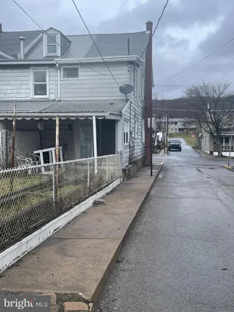 a view of a house with a street