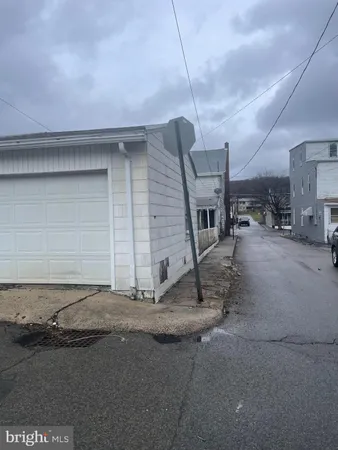 a view of a house with a street