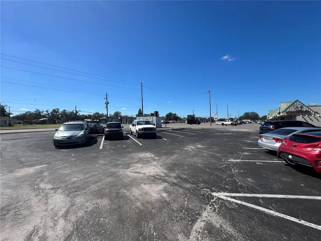 a view of a backyard with sitting area
