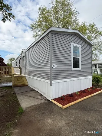 a view of a house with a yard and garage