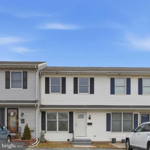 a front view of a building with street view