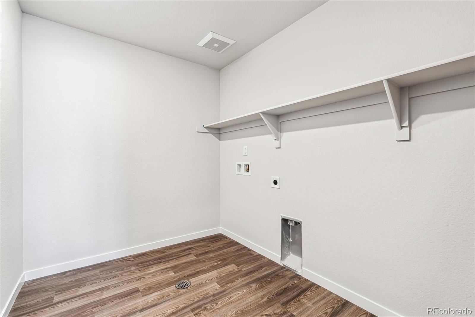 5680 Ranch Street Mead, CO 80504 - Photo 18 of 23 a view of a room with wooden floor