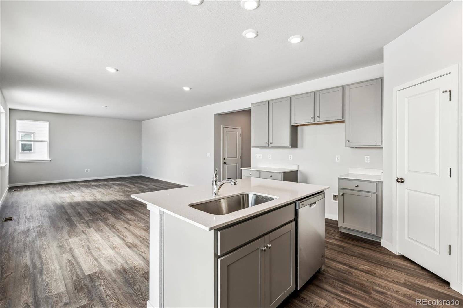 5680 Ranch Street Mead, CO 80504 - Photo 5 of 23 a kitchen that has a sink and a stove in it