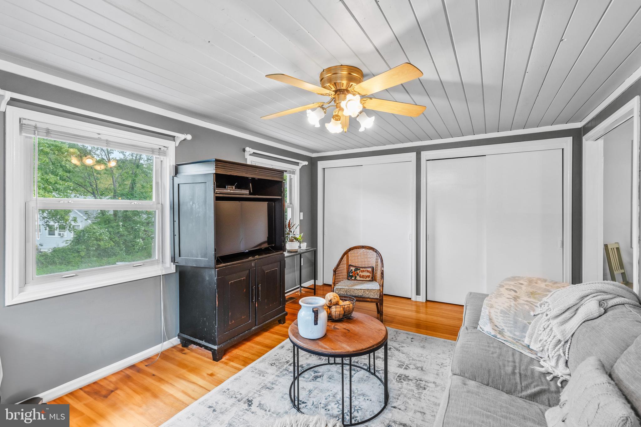 106 Orchard Road Riva, MD 21140 - Photo 17 of 38 a bedroom with a bed and a chandelier