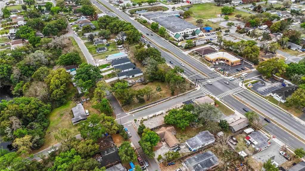 105 North Kirkman Road Orlando, FL 32811 - Photo 8 of 10 an aerial view of residential houses with outdoor space