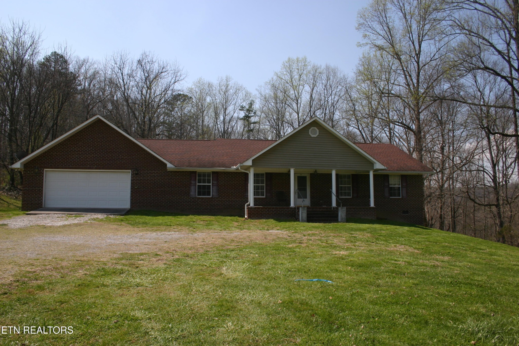 163 Upper Clear Creek Road Andersonville, TN 37705 - Photo 2 of 15 a front view of a house with yard and trees