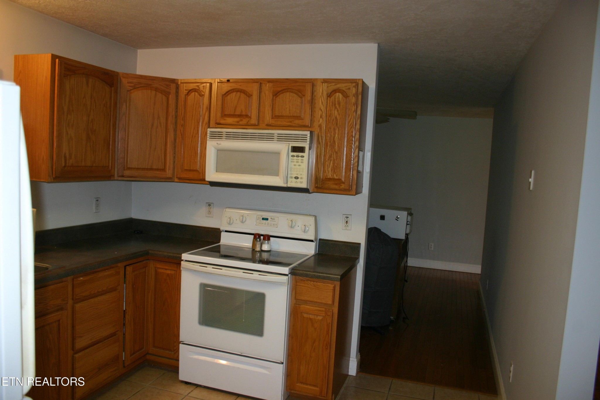 163 Upper Clear Creek Road Andersonville, TN 37705 - Photo 5 of 15 a kitchen with a stove microwave and sink