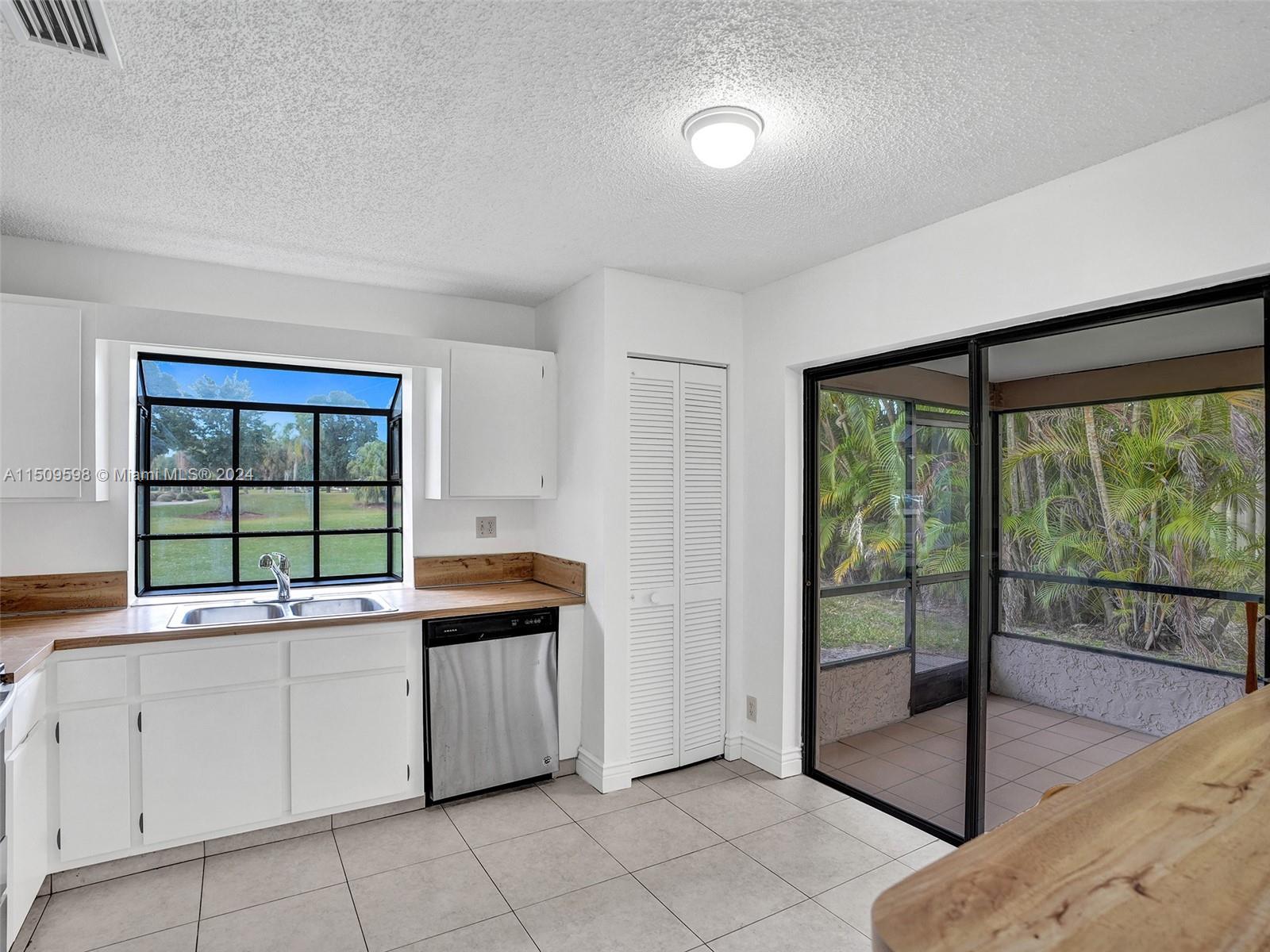 19621 Back 9 Drive Boca Raton, FL 33498 - Photo 12 of 45 a kitchen with a sink and large window