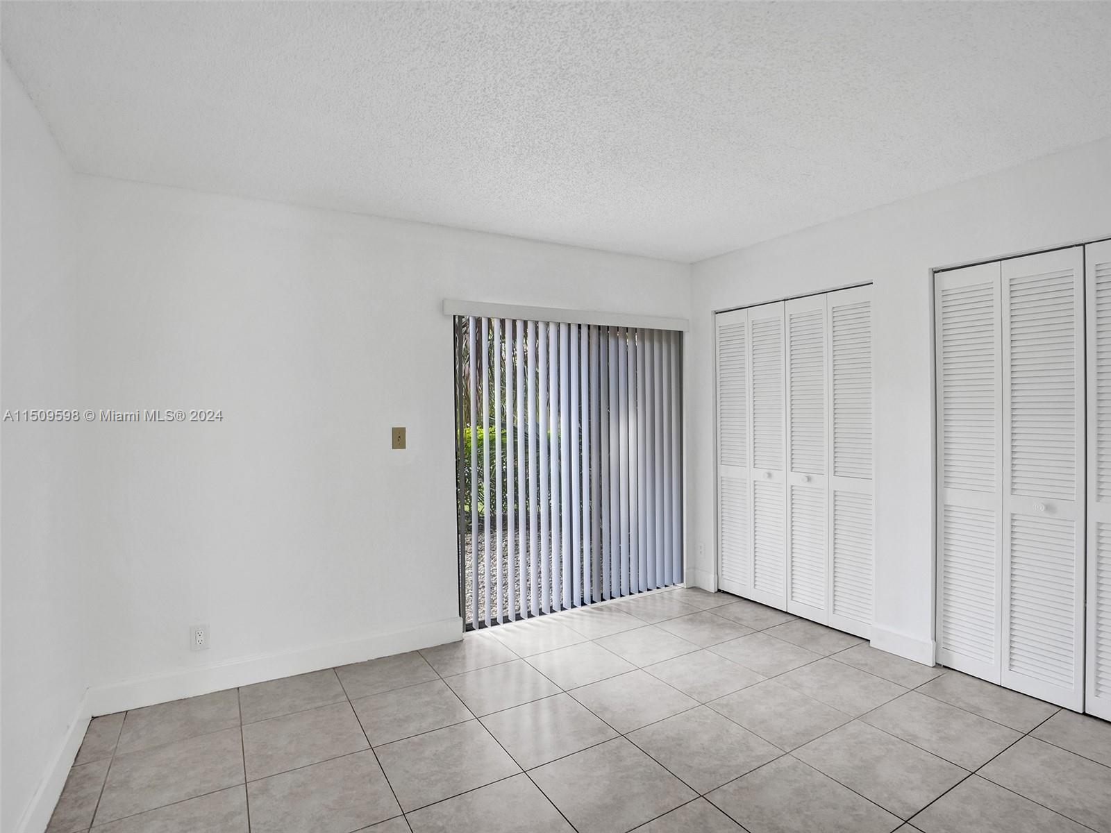 19621 Back 9 Drive Boca Raton, FL 33498 - Photo 17 of 45 a view of a livingroom with an empty space and a window