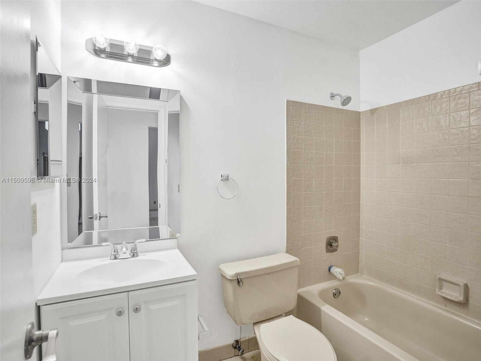 19621 Back 9 Drive Boca Raton, FL 33498 - Photo 20 of 45 a bathroom with a sink toilet and shower