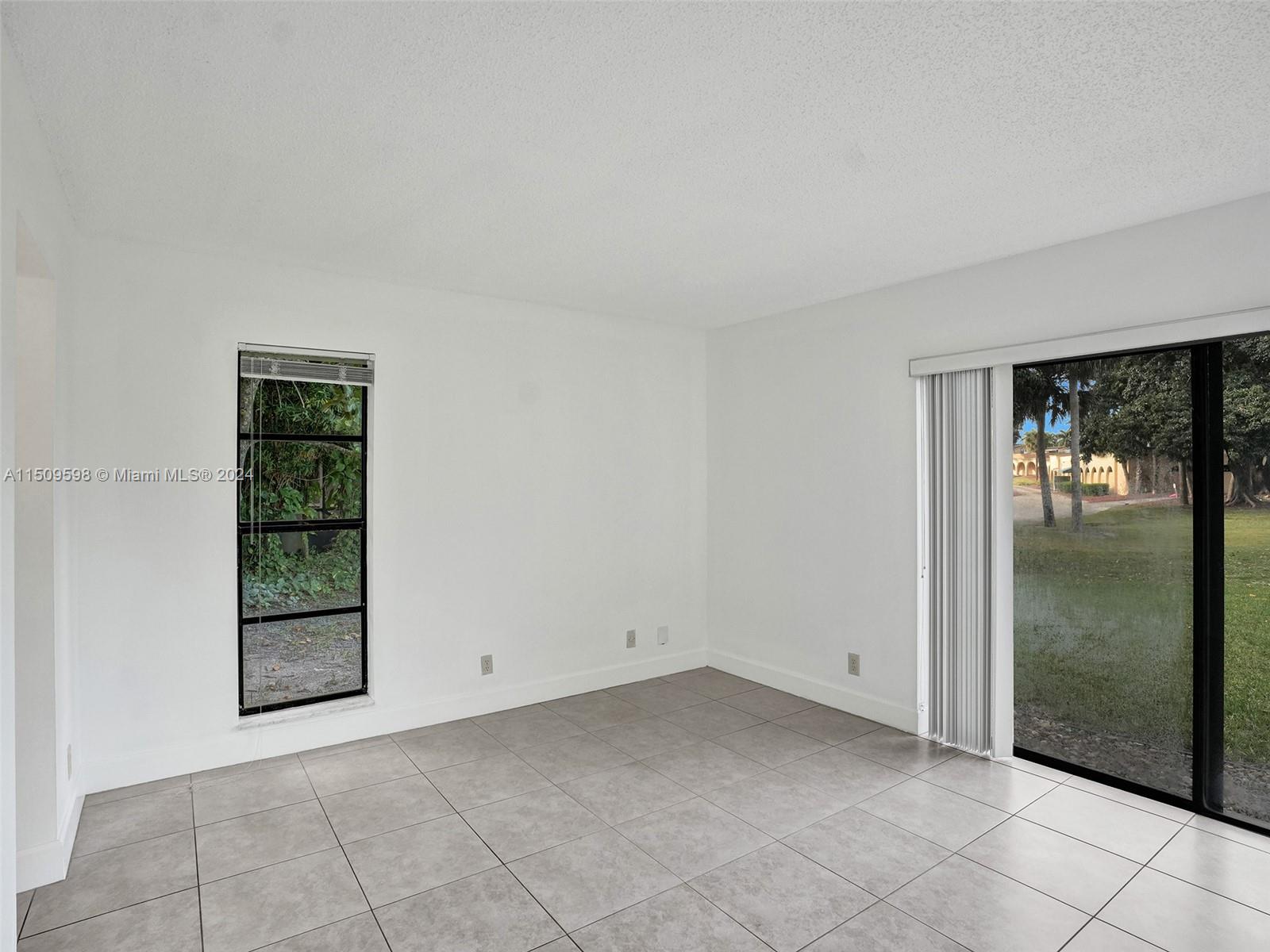 19621 Back 9 Drive Boca Raton, FL 33498 - Photo 22 of 45 a view of an empty room and window