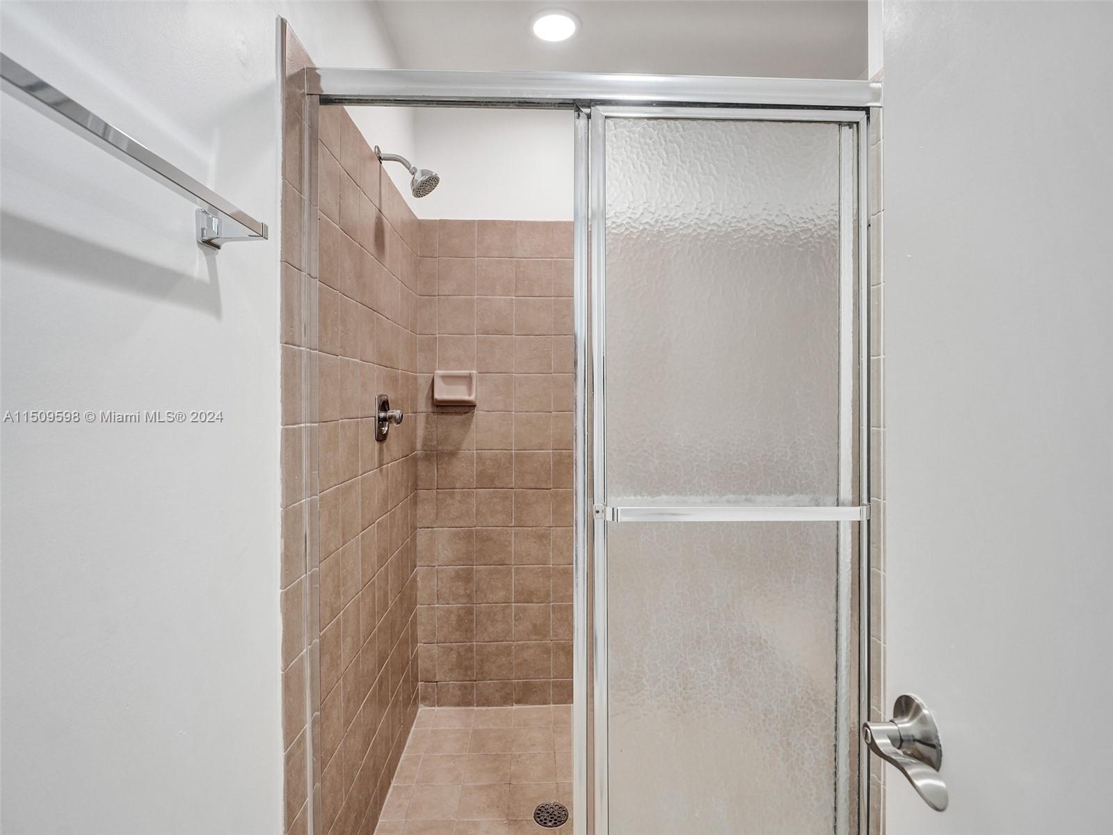 19621 Back 9 Drive Boca Raton, FL 33498 - Photo 28 of 45 a bathroom with a glass shower door
