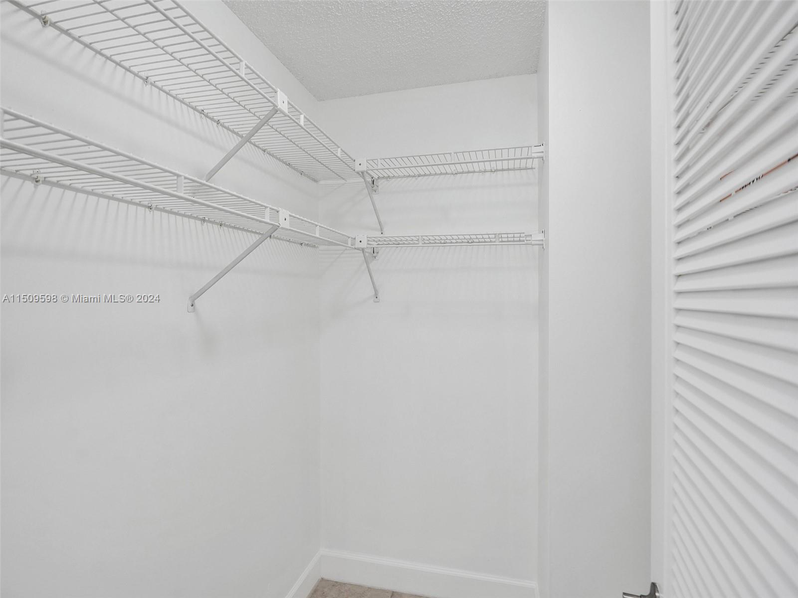 19621 Back 9 Drive Boca Raton, FL 33498 - Photo 29 of 45 a view of a room with racks on the wall