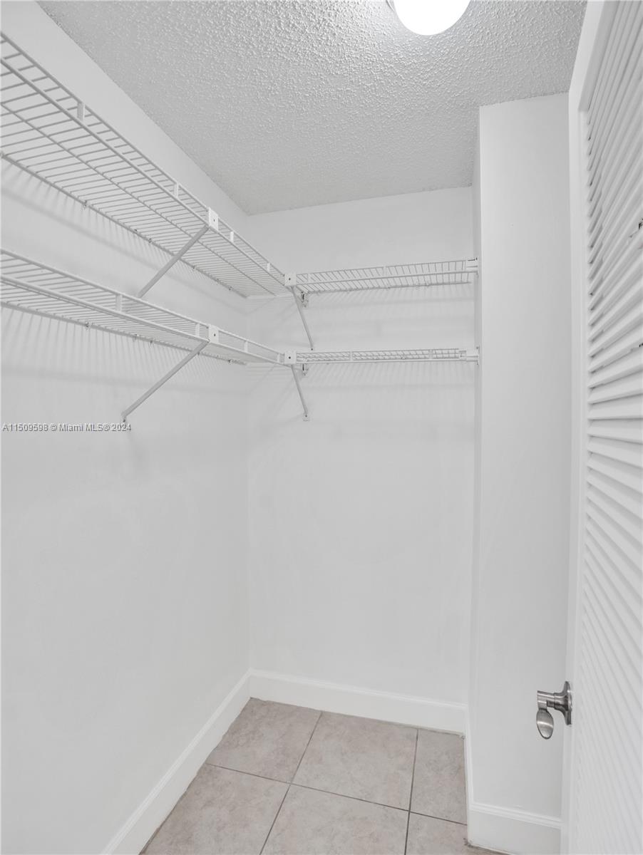 19621 Back 9 Drive Boca Raton, FL 33498 - Photo 30 of 45 a view of a room with racks on the wall